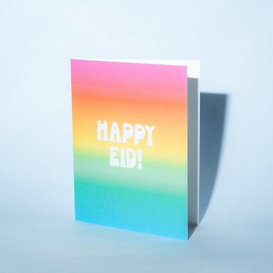 Colorful card with 'Happy Eid!' text on a light blue background