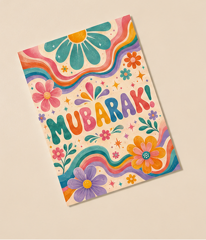 Colorful 'Mubarak!' greeting cards with floral designs on a beige background.