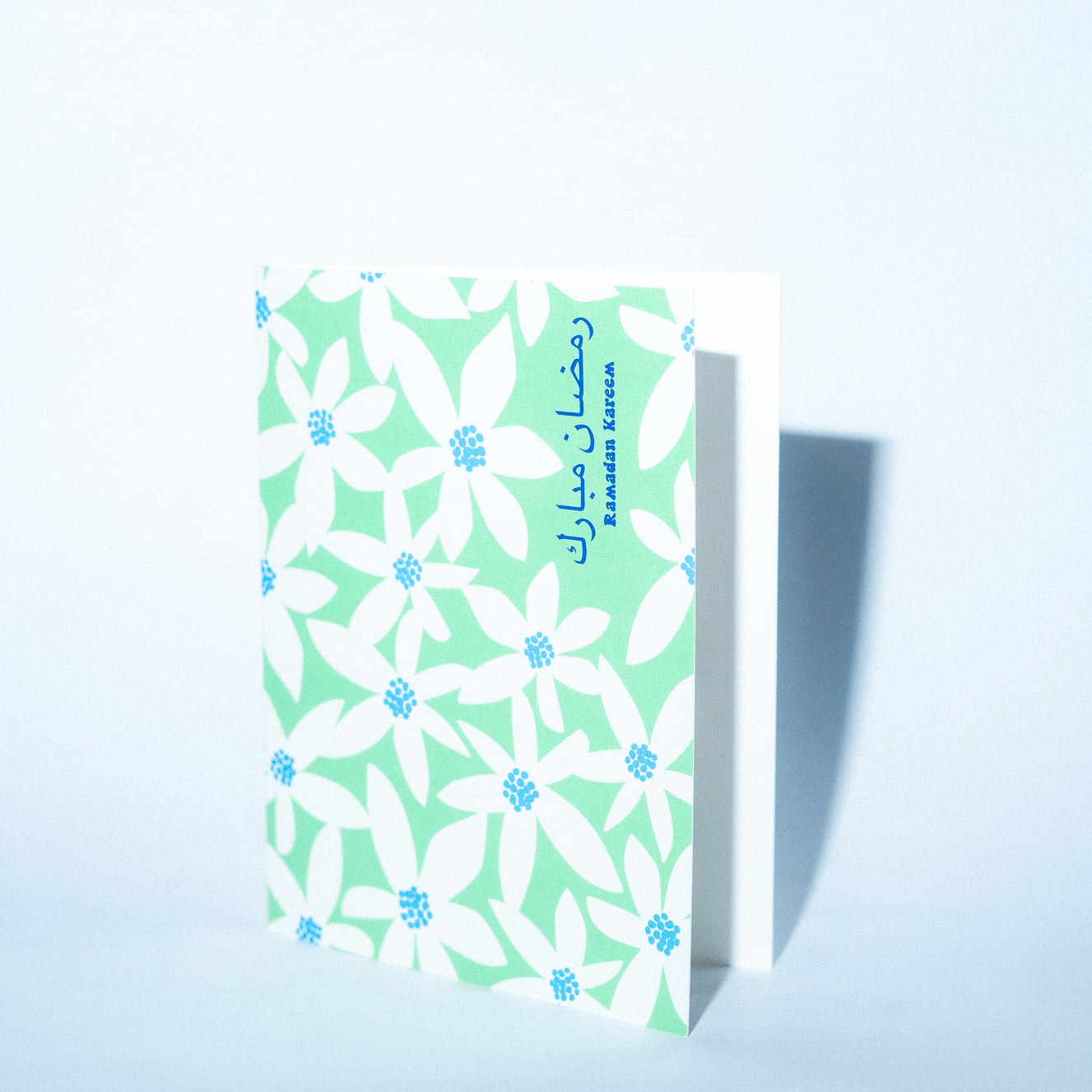 Card with floral pattern on a light blue background