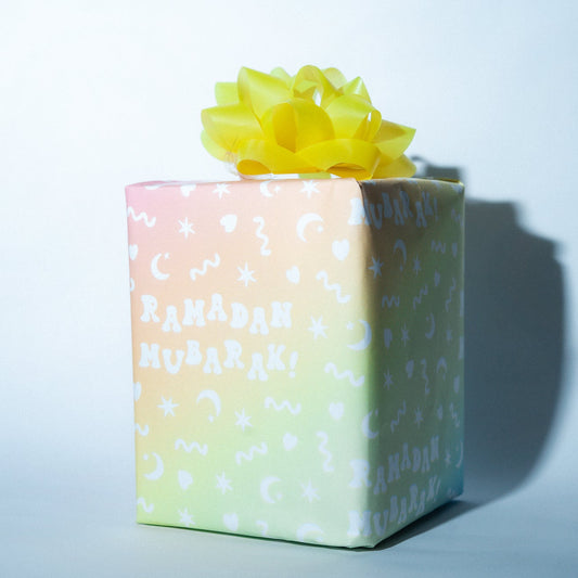 Gift box with a yellow bow on a light blue background