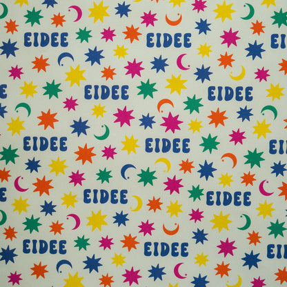 Patterned paper with colorful stars, moons, and the word 'EIDEE' on a light background.